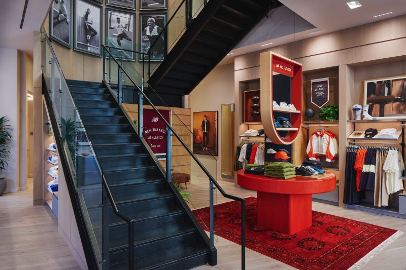 New Balance retail store staircase and feature display with custom millwork